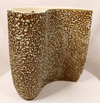 Textured ceramic vase on a white background