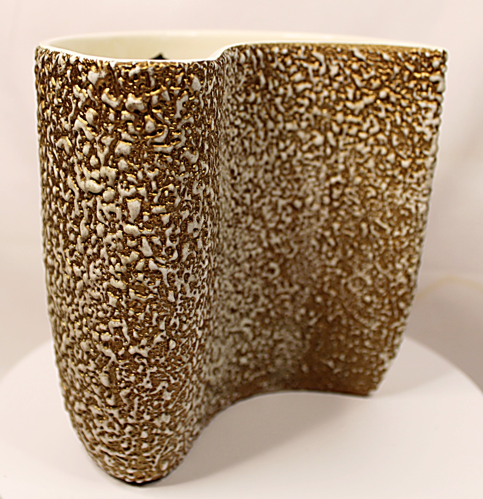 Textured ceramic vase on a white background