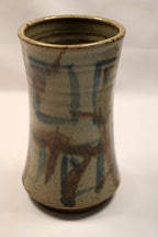 Ceramic vase with abstract patterns on a white background created in 1993 by Bill Heyduck