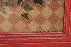 Close-up of a textured surface with a checkered pattern and red frame, featuring the signature 'Diane Ulmer Pedersen' in the corner.