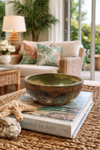 Florida Old River Run Pottery Bowl on tabe with books