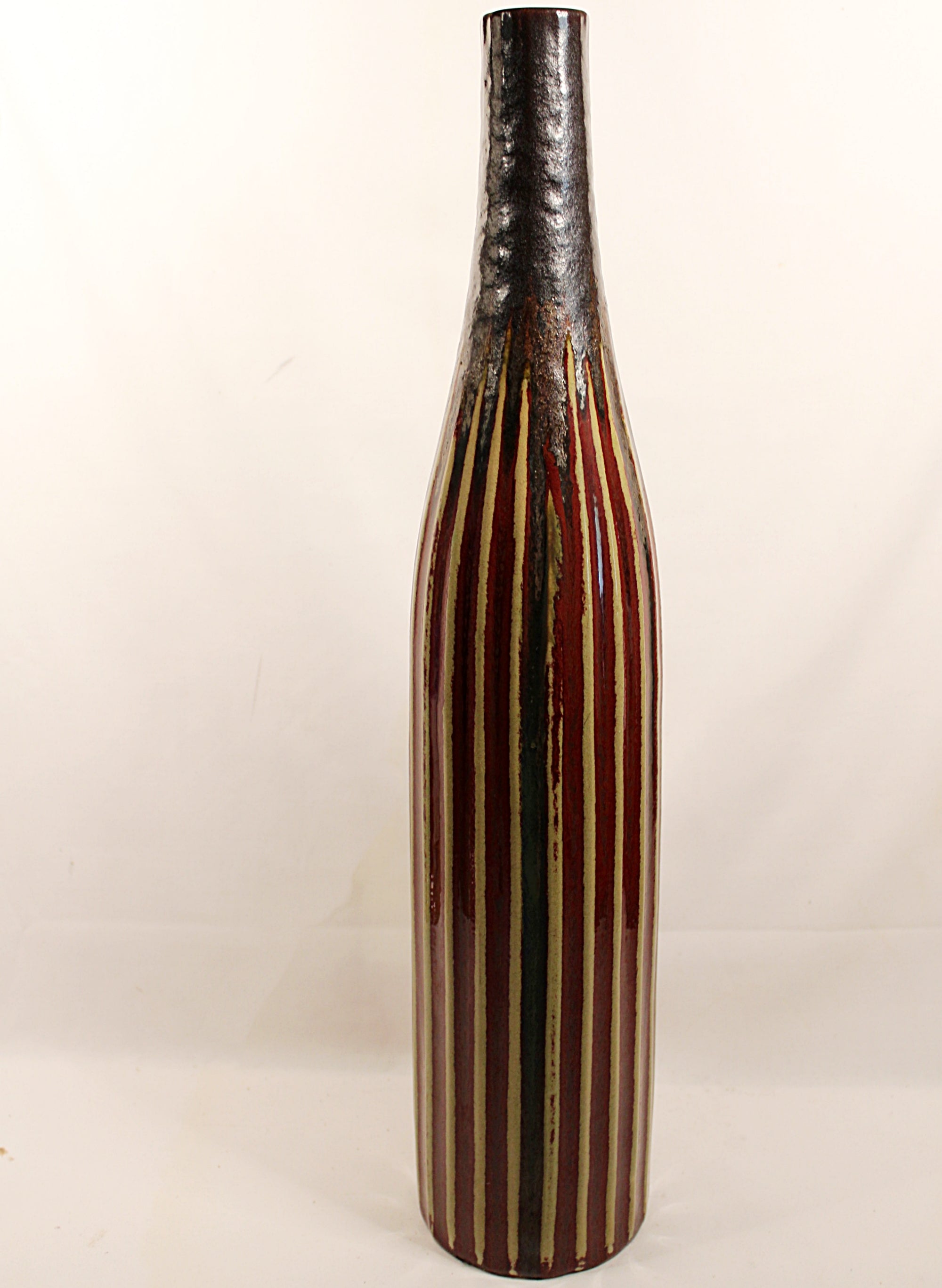 Decorative vase with striped pattern on a white background