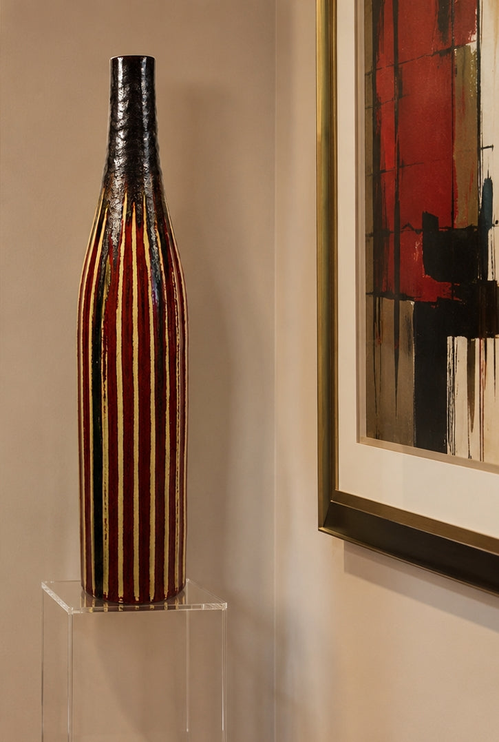 Decorative vase on a clear stand with abstract art in the background