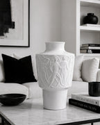 Decorative white vase on a coffee table in a Black and White living room setting