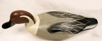 Wooden duck decoy with detailed feathers on a white background Pintail Drake Duck Decoy Jim Burtis Maryland 1994
